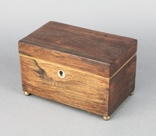 A Victorian rectangular rosewood  twin compartment tea caddy with satinwood stringing and ivory escutcheon, raised on bun feet 4 1/2"h x 7 1/2" x 4 1/2" 
