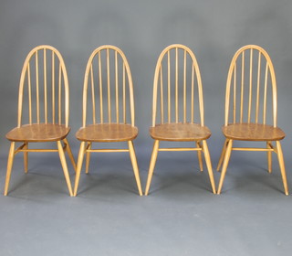 A set of 4 mid 20th Century Ercol beech and elm hoop and stick back dining chairs, marked 1960 2056 
