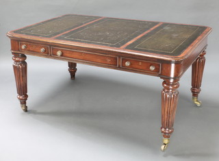 A Victorian style library table with brown inset writing surface, fitted 1 long and 2 short drawers, raised on turned and reeded supports, brass caps and casters 30"h x 61"w x 40"d 1 