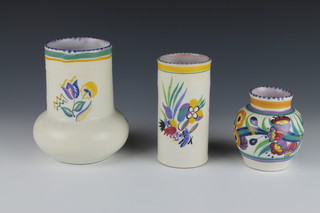 A Poole Pottery cylindrical vase decorated with flowers 5 1/2", a do. bulbous vase 4", do. 6 1/2" 