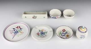 A Poole Pottery circular ashtray decorated with flowers 4", do. dish, posy trough, 3 dishes and a mustard pot and lid 
