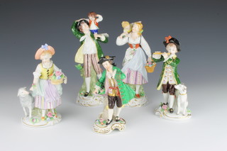 A large pair of 20th Century Sitzendorf figures of a lady and gentleman carrying children 8 1/2", a smaller pair 7", a figure of a gentleman holding an apple 6"
