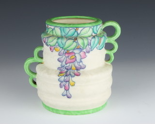 A Crown Ducal Charlotte Rhead jug decorated with spring flowers and triple handles no.211 5 1/2 