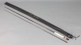 A Regent 9'6" carbon fibre fly fishing rod, as new, complete with fibre case