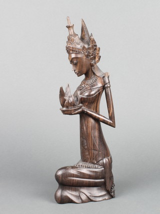 A "Bali" carved hardwood figure group of a kneeling lady 12" 