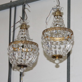 A pair of circular gilt metal and glass bag shaped light fittings 16"h x 7" diam. (1 is missing 3 strands) 
