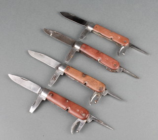 Four multi bladed Swiss Army jack knives 1 with blade marked Wenger and 1 with blade marked Elsener 