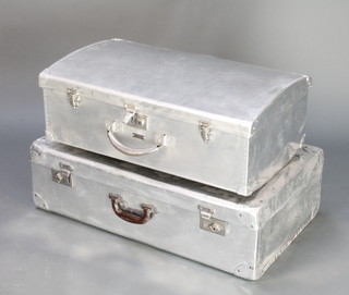 A 1950's chrome suitcase 9" x 26" x 15" and  1 other 8" x 29 1/2" x 18" 
