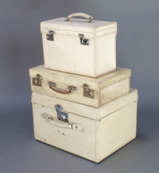 A parchment vanity case with chrome mounts 10" x 14" x 7", 1 other with White Star label 11" x 17" x 14" with chrome mounts (some damage to the edge) and a parchment suitcase 5" x 18" x 11" (edge damaged)