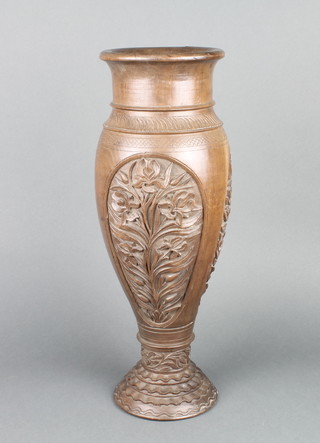 A turned hardwood club shaped vase with floral panels 18"  
