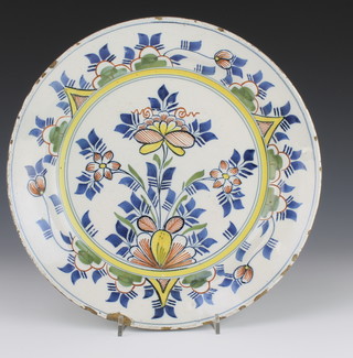 An 18th Century Delft polychrome plate decorated with stylised flowers 12 1/2" 