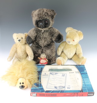 A Steiff bear with articulated limbs 14", a Steiff hedgehog figure 5", a 15" bear with brown ribbon soft toy bear 28", a Dougal figure and a Jouef train set