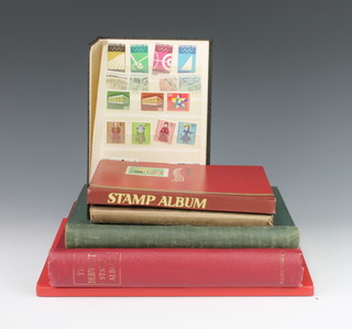 An album of Russian used stamps 1948-1964, a stock book of GB stamps including used penny reds and other stamps, a green Swiftsure album of various used world stamps and 1 other  and 2 stock books of world stamps 


