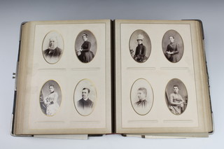 A Victorian leather bound album of black and white photographs (binding f)