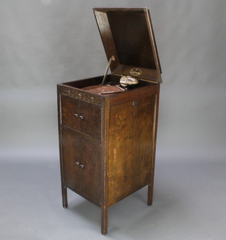 The Dulceola standard gramophone contained in an oak case 36" x 17" x 19" 
