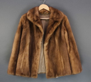  A lady's light mink quarter length fur coat together with a  lady's brown fur coat (some moulting)