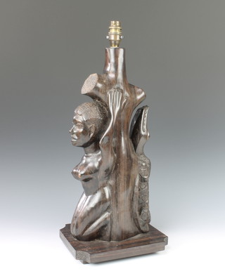 An African hardwood table lamp in the form of a kneeling lady 21" x 9 1/2" x 11 1/2" 