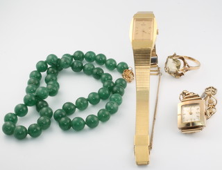 A 9ct yellow gold quartz dress ring size R 1/2, a lady's 9ct gold Marvin wristwatch on a gilt bracelet, a string of hardstone beads with a 14ct gold clasp and a lady's gilt Seiko wristwatch