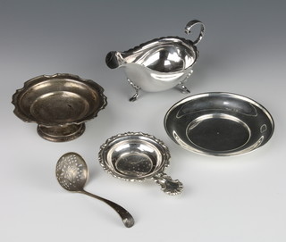 An Edwardian silver sauce boat with S scroll handle Sheffield 1901, a sifter spoon, dish, tazza and tea strainer 215 grams