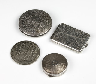 An Edwardian chased silver match sleeve, 2 compacts and a mirror