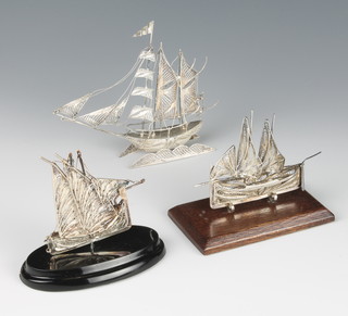 Three silver filigree boats