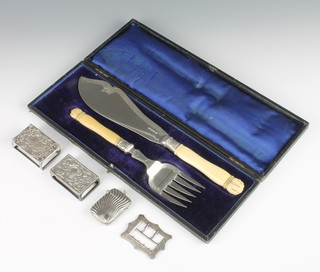 A cased pair of plated fish servers, 2 match sleeves, a vesta and a  buckle 
