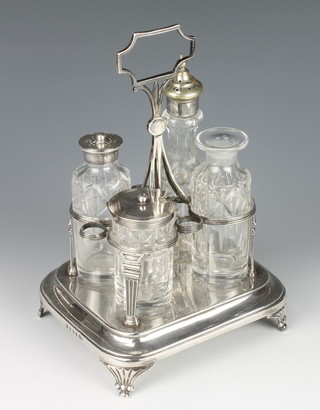 A George III silver cruet stand on scroll feet London 1808 with 4 mounted bottles, unassociated 