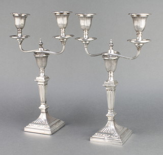 A pair of Victorian silver candelabra with tapered stems having later 2 light sconces 13", mixed dates Sheffield 1859/1863 