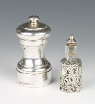 A 925 standard pepper mill together with a silver mounted oil bottle