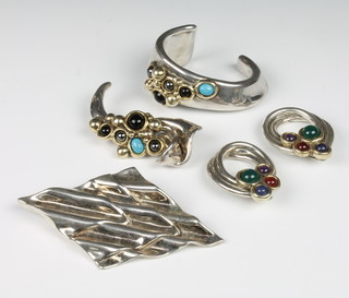 An Israeli silver bangle, a pair of do. ear clips and 2 brooches