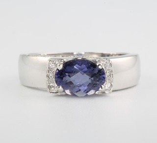 An 18ct white gold tanzanite and diamond ring size N 1/2