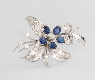 A white gold diamond and sapphire floral spray brooch 45mm x 35mm 