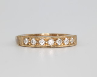 A 9ct yellow gold 7 stone diamond ring size O