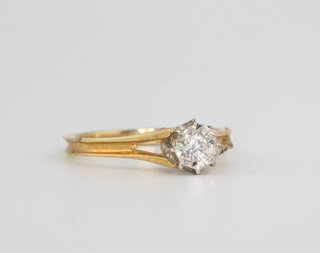An 18ct yellow gold single stone diamond ring, size M