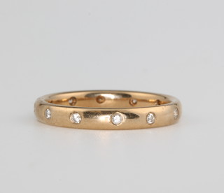 A yellow gold diamond eternity ring size M 1/2