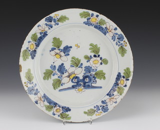 An 18th Century English Delft polychrome dish decorated with flowers and insects enclosed in a floral border 11 1/2" 