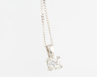 An 18ct white gold single stone diamond pendant approx. 0.3ct on an 18ct white gold chain 