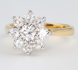 An 18ct yellow gold diamond cluster ring, the centre stone approx 0.30ct surrounded by 8 brilliant cut diamonds approx 0.10ct size L 