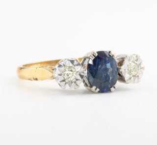 An 18ct yellow gold oval sapphire and illusion set diamond ring size L 