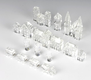 A Swarovski Crystal town comprising 11 buildings and trees and a 4 section train 
