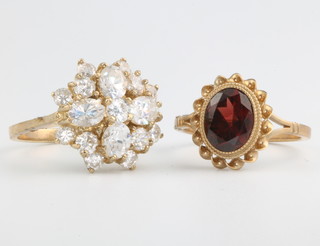 A 9ct yellow gold paste set ring size M 1/2, a garnet do. size M