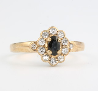 A 9ct yellow gold sapphire and diamond ring size O 