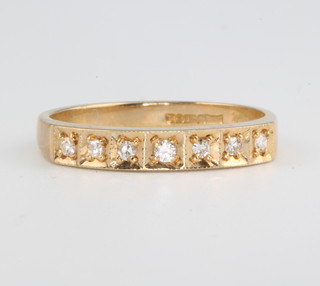 A 9ct yellow gold 7 stone diamond ring size N 1/2