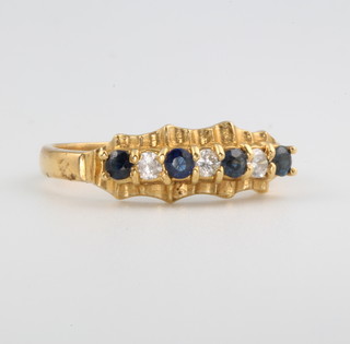 An 18ct yellow gold sapphire and diamond ring size M 1/2