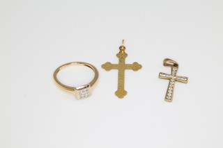 An 18ct yellow gold diamond ring size P 1/2 and 2 9ct yellow gold cross pendants