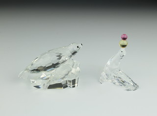 A Swarovski Crystal group of a seal and cub 4" together with a seal balancing 2 balls on his nose 2" 