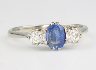 An 18ct white gold tanzanite  and diamond 3 stone ring size M 1/2