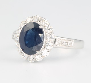 An 18ct white gold oval sapphire and diamond ring, the centre stone 2.19ct, the diamonds 0.56ct size N 