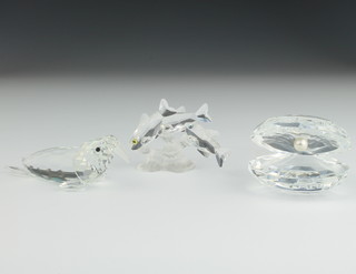 A Swarovski figure of a walrus 4", do. clam shell 3" and a group of fish 3" 