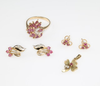 A suite of 9ct yellow gold ruby and diamond jewellery comprising a ring size P 1/2, a pair of earrings and a pendant 